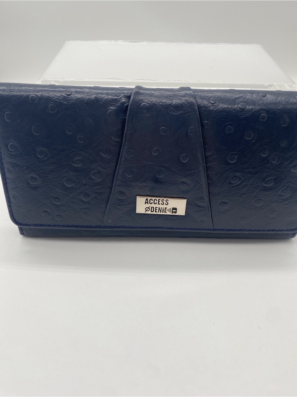 Source Unknown alligator textured leather wallet. RFID protected.